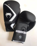 Black and white Venum Contender 2.0 boxing gloves with Velcro fastening. 