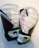 White camo with red detail venum contender2.0 boxing gloves. Velcro fastening.